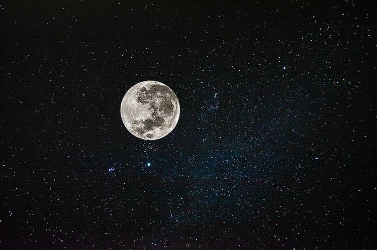 The moon surrounded by the night sky